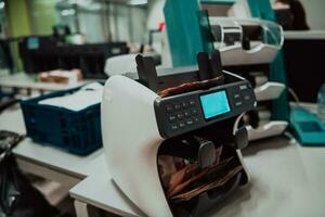 Sorted banknotes placed on the table after it is counted on the electronic money counting machine photo