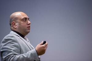 businessman giving presentations at conference room photo