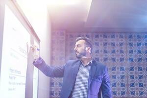 businessman giving presentations at conference room photo