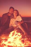 portrait of young Couple enjoying  at night on the beach photo