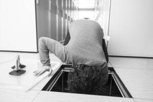 engineer connecting cables in server room photo