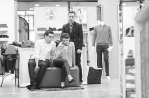 group of best friend shopping in big mall photo