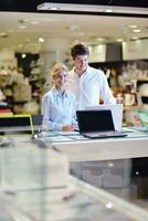 people buy  in consumer electronics store photo