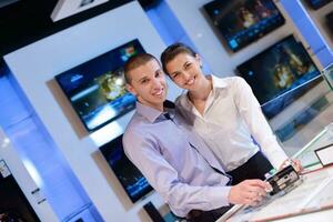 Young couple in consumer electronics store photo