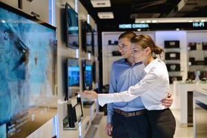 Young couple in consumer electronics store photo