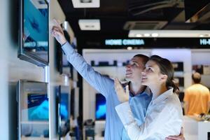 Young couple in consumer electronics store photo