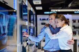 people buy  in consumer electronics store photo