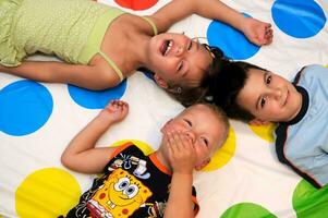 Happy three kids playing together photo