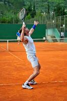 One man play tennis outdoors photo