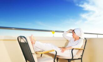 young girl siting in chair, juice, drink, fresh, orange, healthy photo