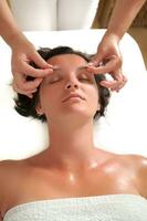 beautiful woman have massage at spa and wellness center photo