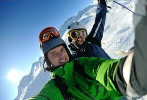 winter portrait of friends at skiing photo