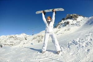 skiing on fresh snow at winter season at beautiful sunny day photo