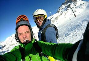 winter portrait of friends at skiing photo