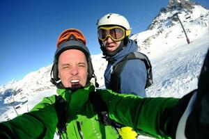 winter portrait of friends at skiing photo