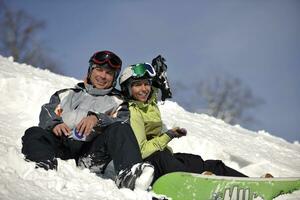 snowboarders couple relaxing photo