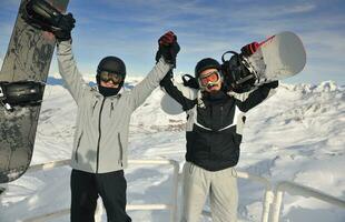 people group on snow at winter season photo