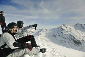 people group on snow at winter season photo