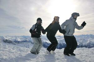 people group on snow at winter season photo