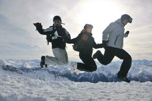 people group on snow at winter season photo