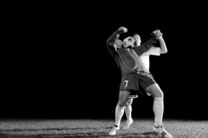 football players in action for the ball photo