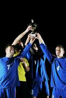 football players celebrating the victory photo