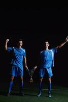 soccer players celebrating victory photo