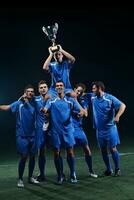 soccer players celebrating victory photo