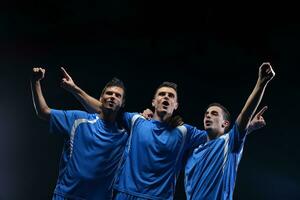 soccer players celebrating victory photo