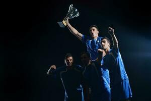 soccer players celebrating victory photo