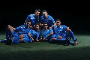 soccer players celebrating victory photo