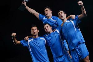 jugadores de fútbol celebrando la victoria foto