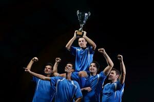 soccer players celebrating victory photo