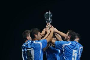 soccer players celebrating victory photo