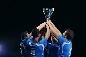 soccer players celebrating victory photo