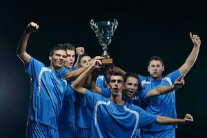 soccer players celebrating victory photo