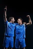 soccer players celebrating victory photo