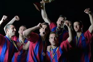 soccer players celebrating victory photo