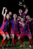 soccer players celebrating victory photo