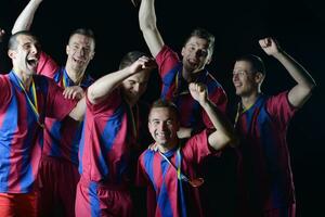 soccer players celebrating victory photo