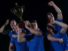 soccer players celebrating victory photo