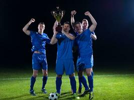 soccer players celebrating victory photo