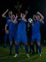 soccer players celebrating victory photo