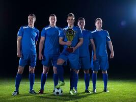 soccer players celebrating victory photo