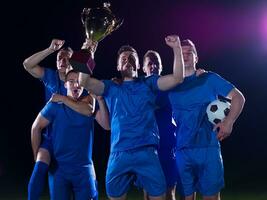 soccer players celebrating victory photo