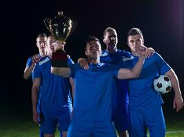 soccer players celebrating victory photo