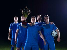 soccer players celebrating victory photo