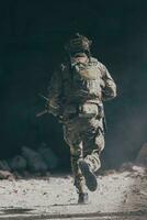 A bearded soldier in uniform of special forces in a dangerous military action in a dangerous enemy area. Selective focus photo