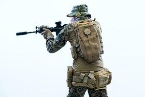 soldier in action aiming laseer sight optics photo