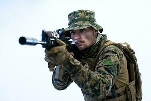 soldier in action aiming laseer sight optics photo